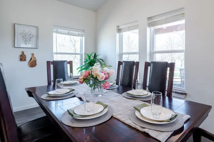 Enjoy a relaxing meal after a day outdoors and on the lake around a table with seating for 6.
